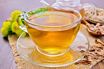 Image showing Tea of Rhodiola rosea in glass cup on board