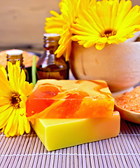 Image showing Soap homemade and oil with calendula on bamboo