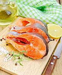 Image showing Trout on board with knife and napkin