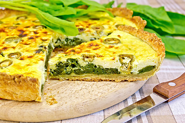 Image showing Pie with spinach on the tablecloth