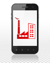 Image showing Business concept: Smartphone with Industry Building on display