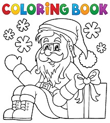 Image showing Coloring book with Santa Claus and gift