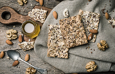 Image showing dietic cookies honey and nuts on rustic table
