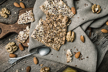 Image showing Tasty Cookies with seeds nuts honey on wood for diet