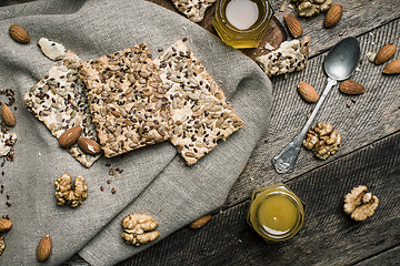 Image showing dietic Cookies with seeds nuts honey on wood