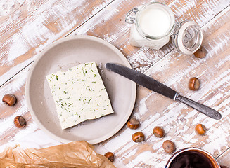 Image showing cheese with dill and joghurt for breakfast on wooden table