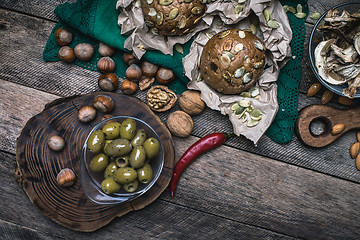 Image showing healthy eating olives, nuts mushrooms  and bread buns 