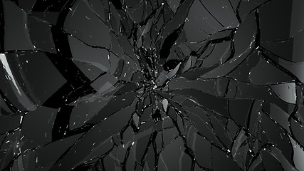 Image showing Pieces of splitted or shattered glass on black