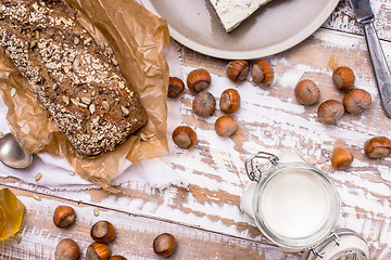 Image showing Healthy meal Bread with seeds huzelnuts and cheese on table