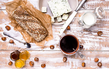 Image showing Morning tea Bread with seeds and cheese on wooden table