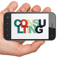 Image showing Finance concept: Hand Holding Smartphone with Consulting on  display