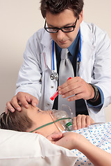 Image showing Doctor checking patient eyes