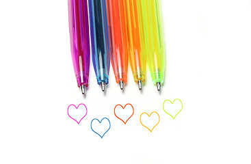 Image showing Bright colorful pens and abstract hearts