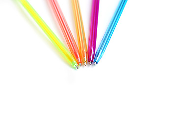 Image showing Colorful pens on white background