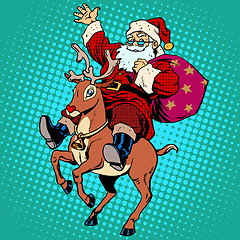 Image showing Santa Claus with gifts Christmas reindeer Rudolf