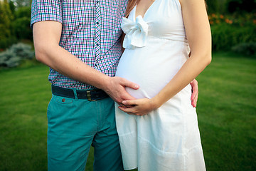 Image showing Happy and young pregnant couple in nature