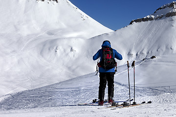 Image showing Skier on ski slope at sun day