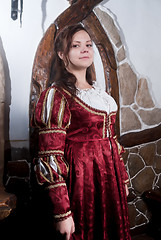 Image showing Attractive woman in red dress of retro style