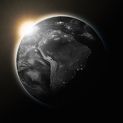 Image showing Sun over South America on dark planet Earth