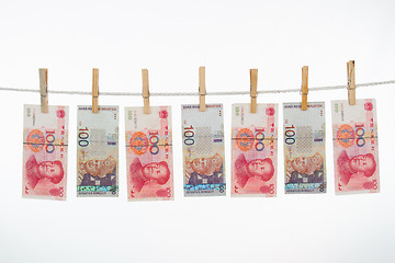 Image showing China and Malaysia Currency on Clothesline