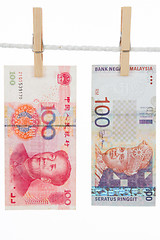 Image showing China and Malaysia Currency on Clothesline