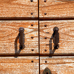 Image showing door    in italy old ancian wood and traditional  texture nail