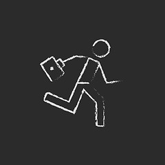 Image showing Paramedic running with first aid kit icon drawn in chalk.