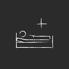 Image showing Patient lying on the bed icon drawn in chalk.