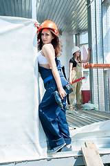 Image showing Young attractive women on construction site