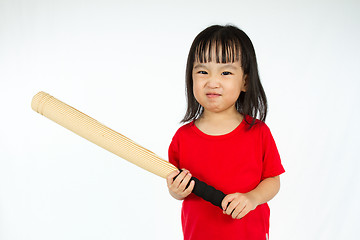 Image showing Chinese little girl holding baseball bat with angry expression