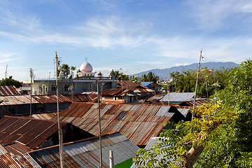 Image showing roof of poor houses by the river