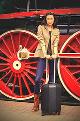 Image showing Travel portrait of a beautiful adult woman with luggage