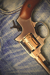 Image showing Nagan revolver on blue jeans