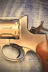 Image showing Nagan revolver on blue jeans background