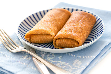 Image showing Crepes stuffed with cottage cheese.