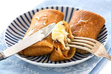 Image showing Crepes with cottage cheese and honey.