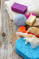 Image showing Set for a bath. Towels, soap, scrub, aromatic bomb.