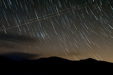 Image showing starry night with star trails over lake santeetlah and great smo