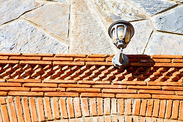 Image showing rocks stone and red street lamp