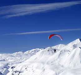 Image showing Sky gliding in snowy mountains at nice sun day