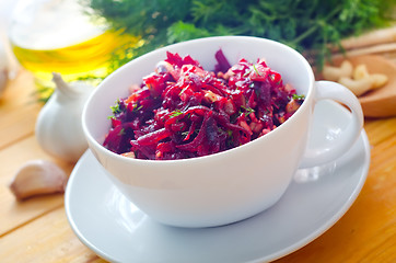 Image showing Fresh salad with beet and walnuts, vegetarian salad