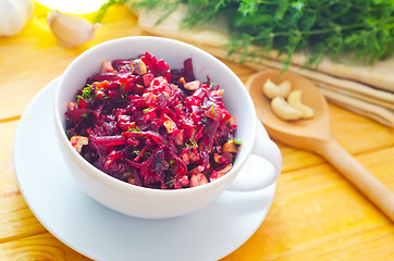 Image showing Fresh salad with beet and walnuts, vegetarian salad