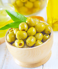 Image showing green olives and oil