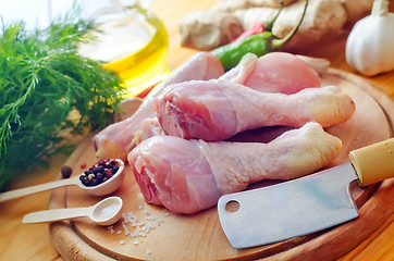 Image showing Raw chicken on wooden board, Chicken with spice