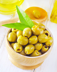 Image showing green olives and oil