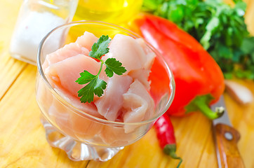 Image showing raw chicken and raw vegetables on wooden table