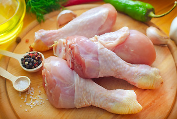Image showing Raw chicken on wooden board, Chicken with spice
