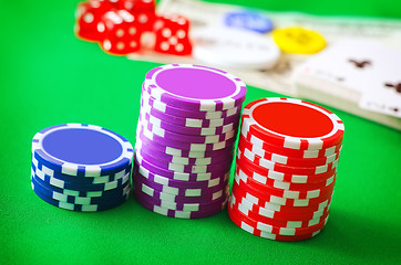 Image showing Group from chips for poker on the green background