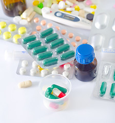 Image showing color pills and medical bottle