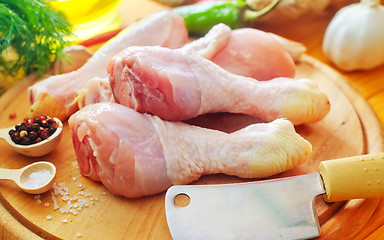 Image showing Raw chicken on wooden board, Chicken with spice